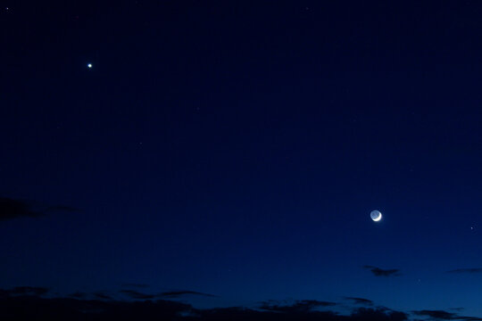 crescent moon, jupiter and venus in the sky
