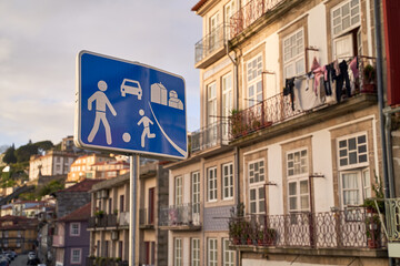 Home zone road sign in Porto, Protugal on old houses background