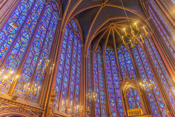 Paris, France - Dec. 27 2022: The stunning stained glass window and the beautiful ceiling in...