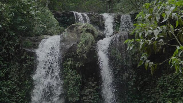 The unspoiled and beautiful Grenjengan Kembar waterfalls are located in the middle of the wilderness of Mount Merbabu National Park. Slow motion footage of dramatic waterfall with water splashes