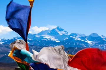 Fotobehang Lhotse  Witness the awe-inspiring magnificence of Mount Everest while Tibetan prayer flags dance in the breeze, crafting a vibrant mosaic at Pang La pass (5248 m) near Tingri, Tibet.