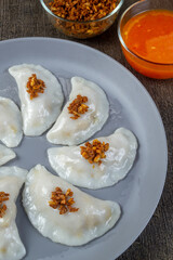 Choipan or Choi pan is a Pontianak snack made from rice flour. The filling is shaved jicama, chives cooked with dried shrimp. top view food
