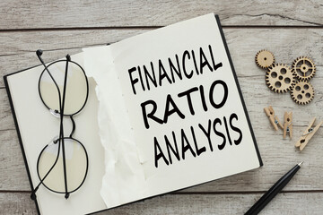 Financial Ratio Analysis glasses on an open notepad. text on page