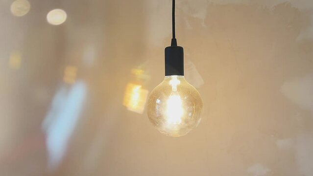 Vintage lamp with warm light in cafe, decorative glowing ambiance