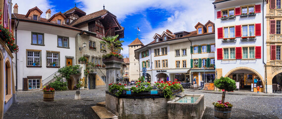 Charming medieval towns and vilages of Switzerland - old town of Murten with floral streets, canton Fribourg - obrazy, fototapety, plakaty