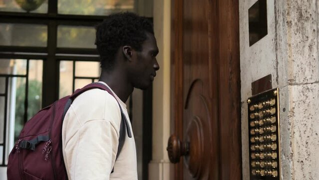 seek hospitality- young black man rings the intercom without getting an answer