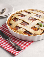 Homemade apple pie with apple jam on red napkin