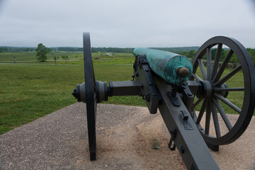 12 pounder bronze smooth bore, Napoleon Model 1857 at Gettysburg National Military Park, Pennsylvania. Battlefield in the background