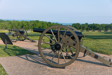 3-inch ordnance rifle, cast iron artillery piece model 1861 at Gettysburg. Battlefield in the background