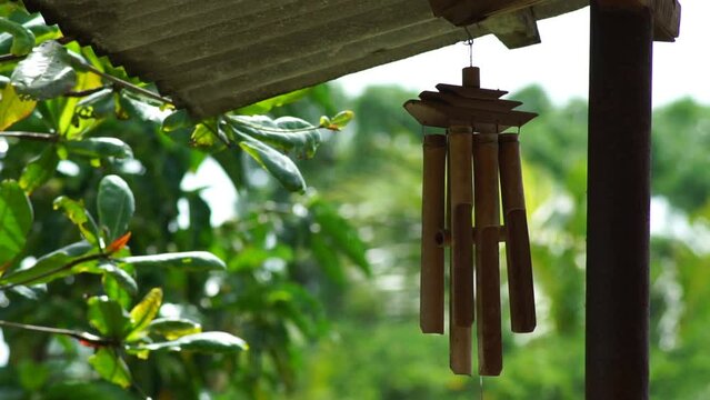 tranquility moment  with wind chimes on the porch when it rains