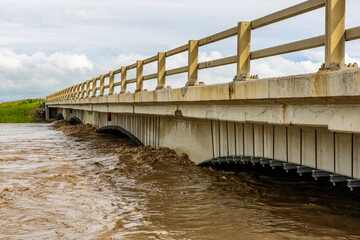 Rising Flood Waters Threaten Bridge