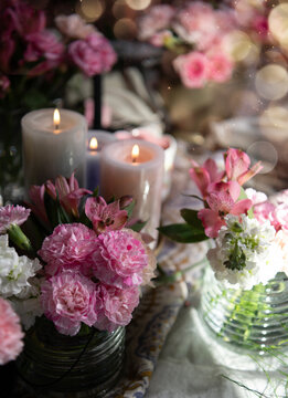 Pink carnations and candles 
