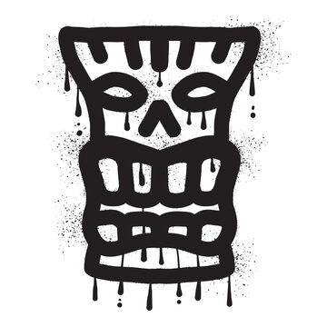Wooden tiki mask graffiti with black spray paint art
