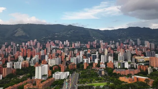 Colombia top cinematic aerial view. El Poblado, Medellín. Panoramic aerial city view. 