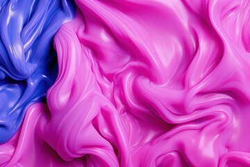 a close up of a pink and blue liquid