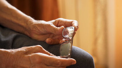 Close-up of an elderly man's hands expressing excitement