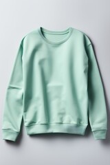 Mint blank sweater without folds flat lay isolated on gray modern seamless background 