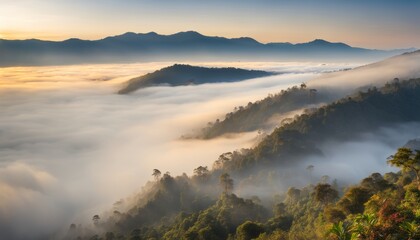 Obraz premium Majestic mountain peaks rise above the misty clouds