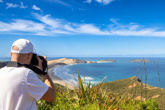 Man taking a photo, Cape Maria van Diemen, northland, New Zealand