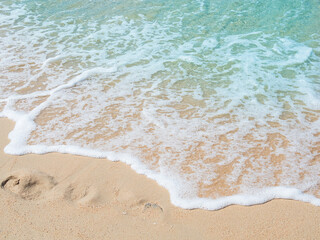 Travel Nature Concept, Sea Sand Background Blue Water at Coast Season Summer Tropical Ocean Beautiful Wave Seascape Vacation Smooth Wallpaper Island Outdoor Tropical Coast Sandy Nature Landscape.