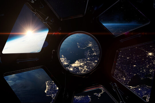 Europe at night. View on night Earth from porthole on space station. ISS window. International space station and Earth planet with stars view. Elements of this image furnished by NASA.
