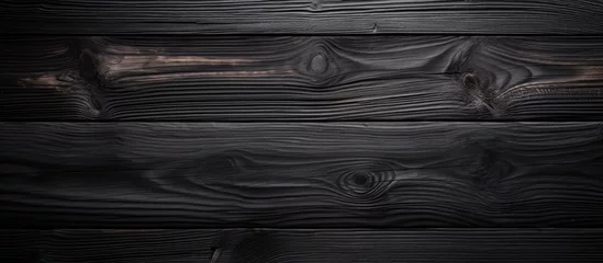 Foto auf Leinwand A dark wood background featuring a detailed wooden grain pattern. The texture of the wood is prominently displayed, creating a visually captivating surface. © Emin