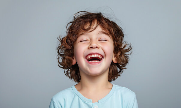 Joyful Child Laughing Heartily - World Laughter Day Concep