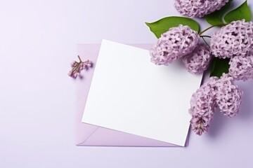 Elegant lilac flowers beside a blank card for personal messages. Lilac Blooms with Blank Greeting Card Mockup