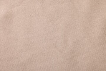 Texture of beige fabric as background, top view