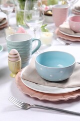 Festive table setting with elegant dishware, closeup. Easter celebration