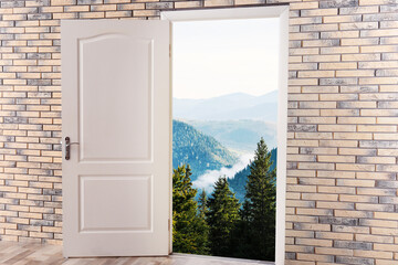 Beautiful mountain landscape visible through open door