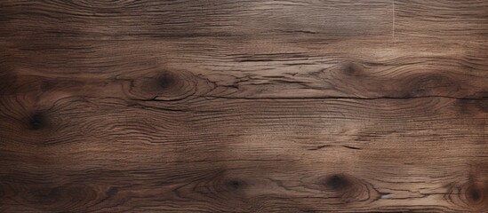 A close-up view of a wooden floor made of bleached dark oak panels against a brown background. The texture of the wood is visible, enhancing the warm and natural aesthetic of the scene. - obrazy, fototapety, plakaty