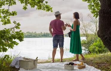 couple spending time together on a picnic in nature - 749082187