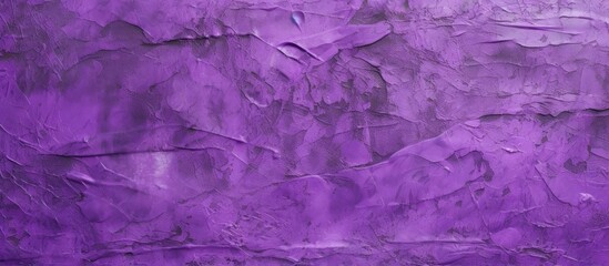 Obraz premium A textured purple wall with visible cracks and patches of filler paste applied in chaotic strokes and dashes. The aged wall shows signs of wear and tear.