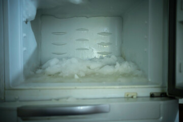 Fototapeta na wymiar Frost accumulated in freezer.