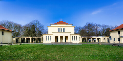 Fototapeta na wymiar mourning hall and entrance to the jewish cemetery in cologne bocklemünd on a sunny day with blue sky