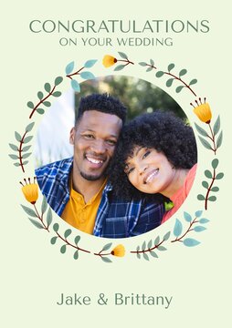 Celebrating love, a couple's joyous faces framed by a floral wreath symbolize unity and happiness