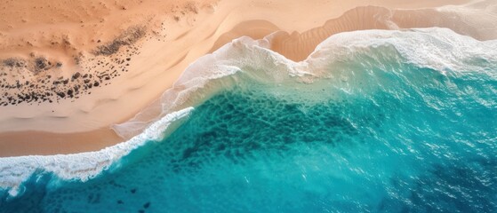 Aerial top view of ocean sea waves on desert beach dunes with beautiful crystal clear turquoise water banner background
