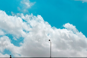 A sunny blue cloudy day in Ikeja Lagos Nigeria--With a tiny part of the bridge in a distant view