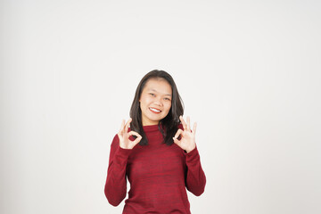 Young Asian woman in Red t-shirt smiling and showing okay sign isolated on white background