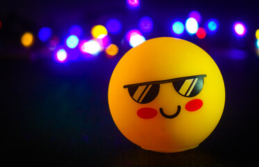 Yellow emoticon with bokeh background 