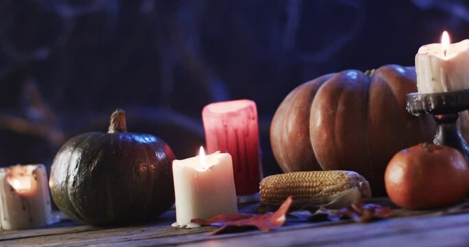 Candles and pumpkins set a cozy autumn mood, with copy space