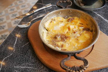  Egg Omelette with sausage on table 