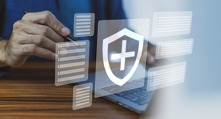 Man using computer buy insurance online, insurance investment concept