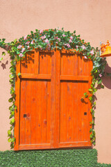 Fototapeta na wymiar orange color wooden door texture background