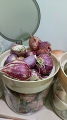 Collection of Shallots in a Jar in the Kitchen