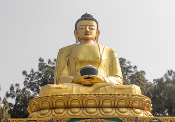 Fototapeta premium Golden statue of Buddha at Buddha Park, Swayambhunath, Kathmandu, Nepal