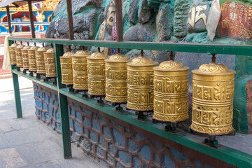 Prayer wheels is spun by devotees to aid for meditation and accumulating wisdom, good karma and putting negative energy aside