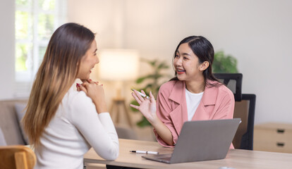 Two young asian happy business women working together for analyze planning and financial statistics and investment market  in home office space