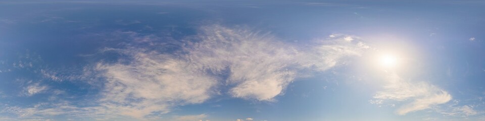 Blue summer 360 panorama of sky with clouds, no ground, in spherical equirectangular format for easy use in 3D graphics and aerial or ground composites, seamless and suitable for sky replacement.